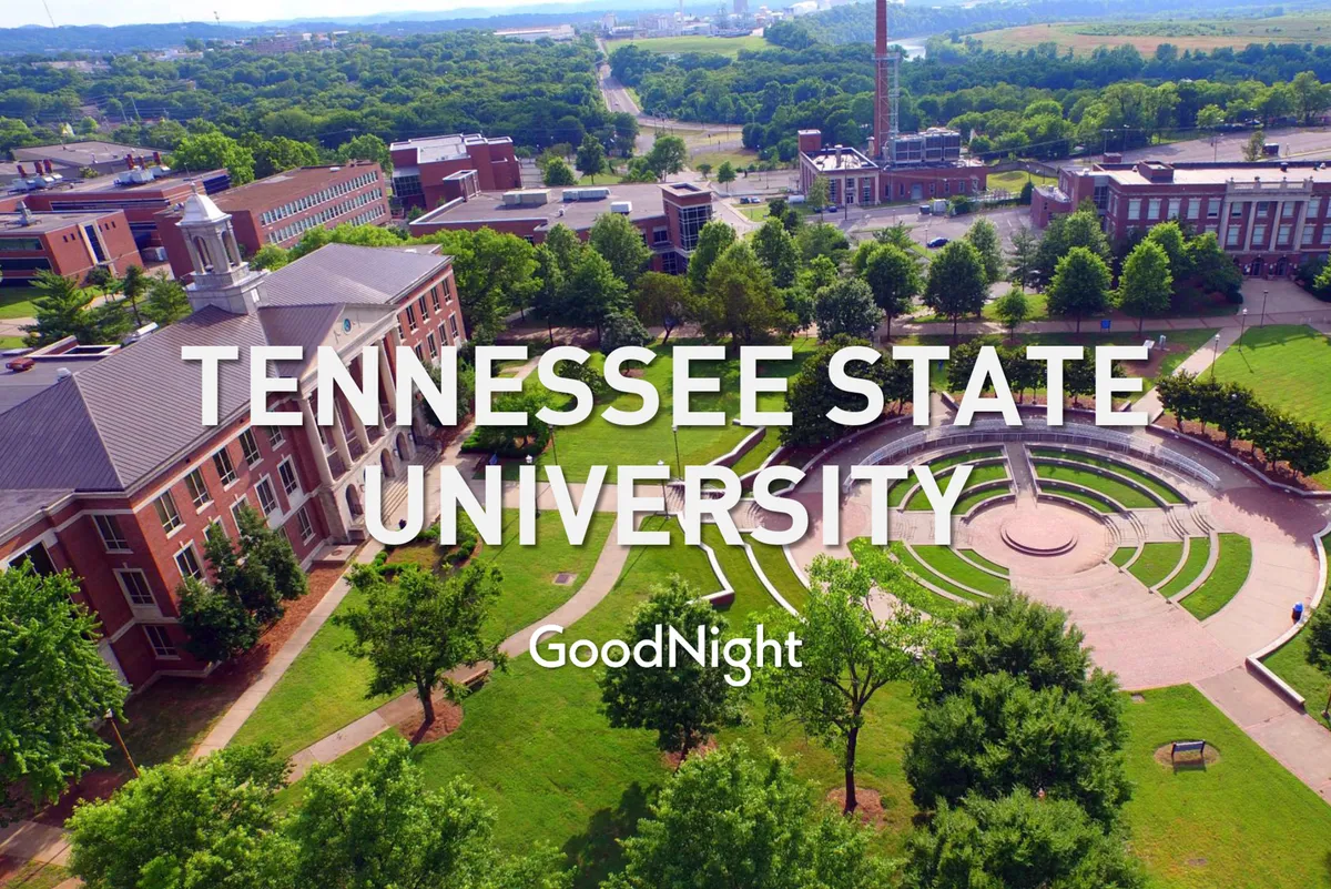 The campus grounds of Tennessee State University featuring expansive green lawns, shady trees, and walkways. The lively atmosphere suggests community gatherings and opportunities for leisurely walks.